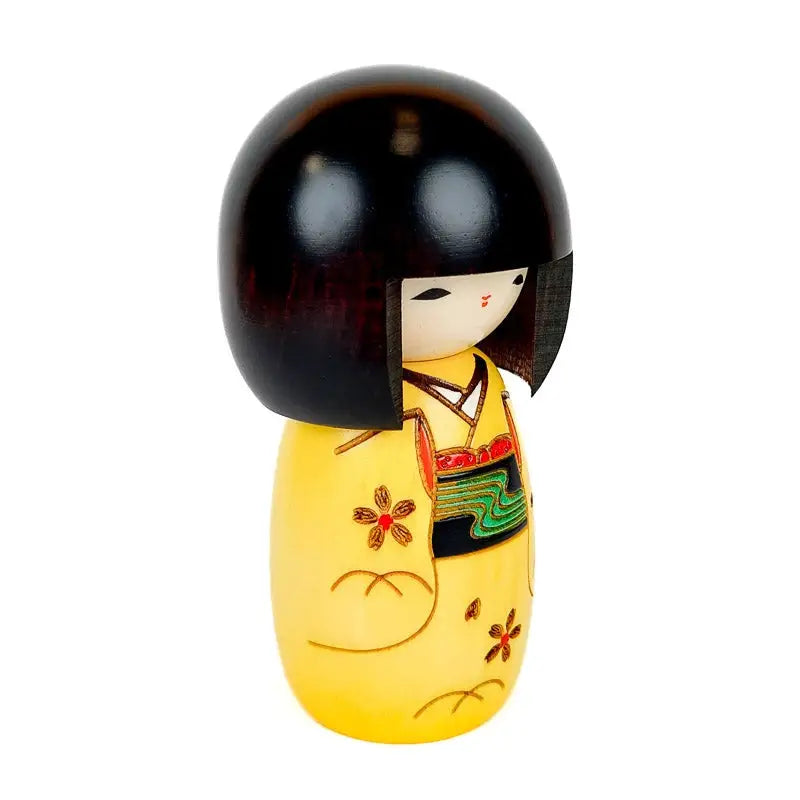 Bambola kokeshi gialla