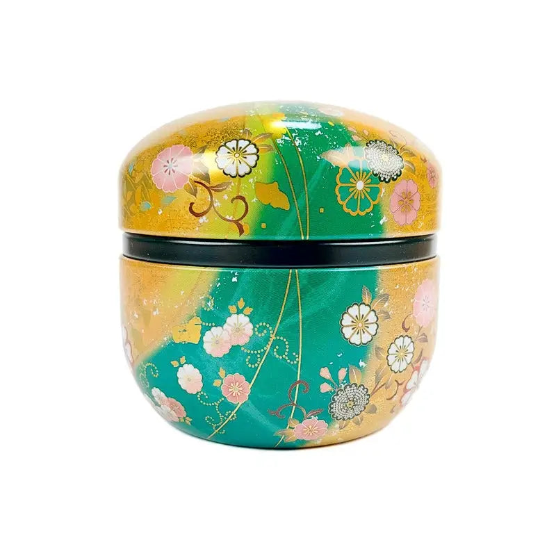 Scatola da tè rotonda verde e oro