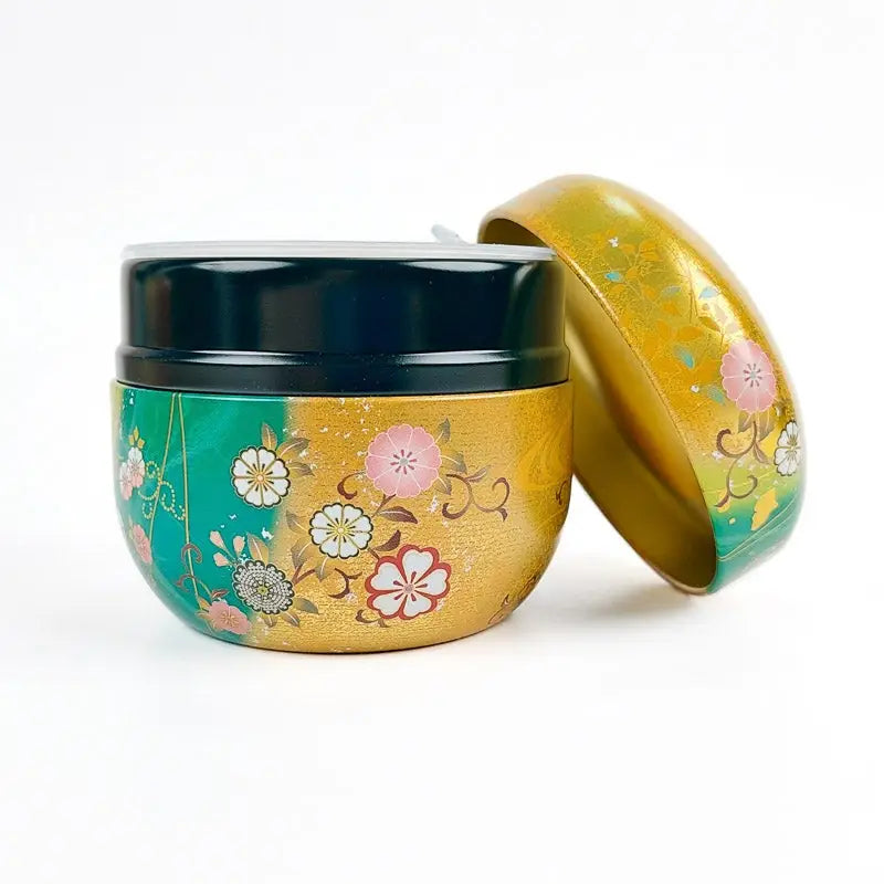 Scatola da tè rotonda verde e oro