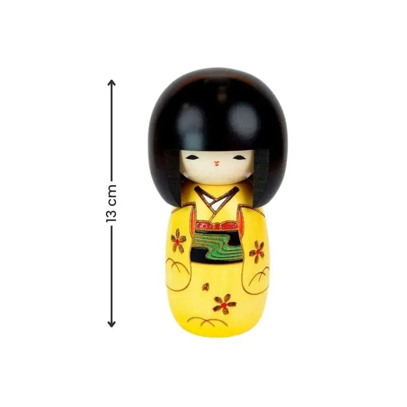 Bambola kokeshi gialla