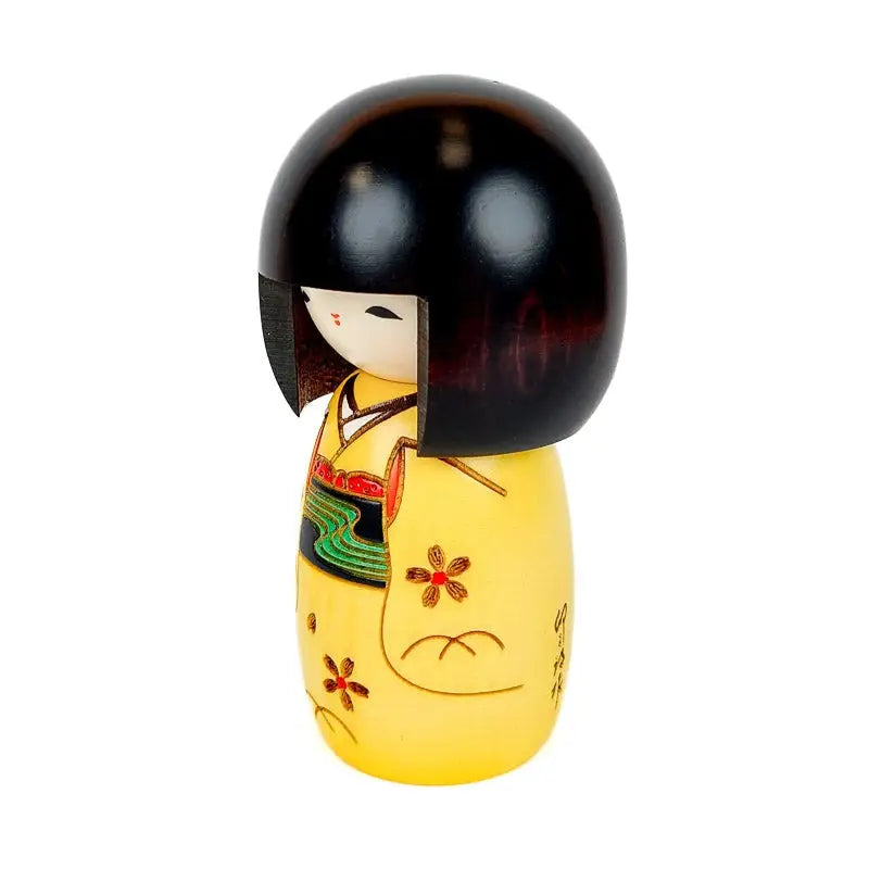 Bambola kokeshi gialla