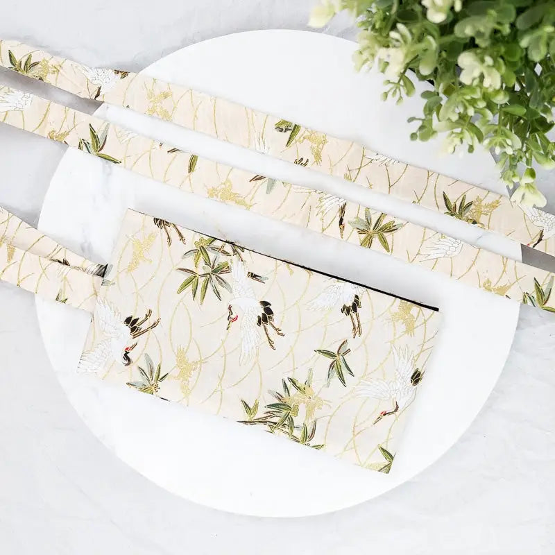 Cintura Obi beige con gru