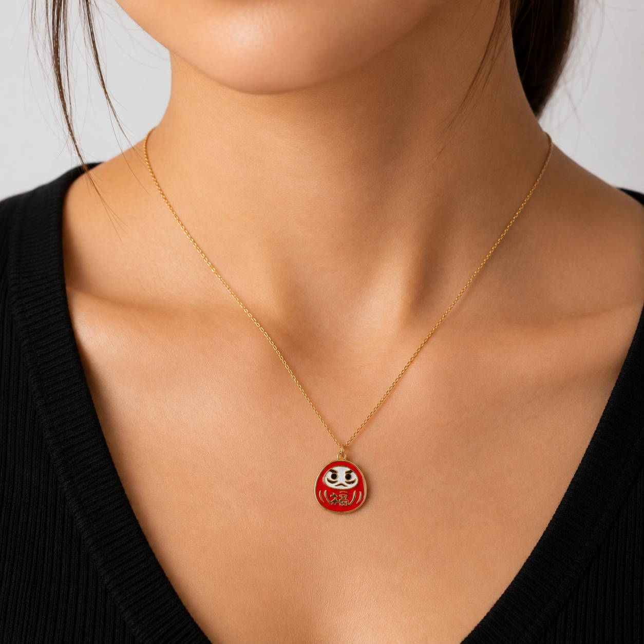 Collana giapponese con ciondolo Daruma rosso e oro