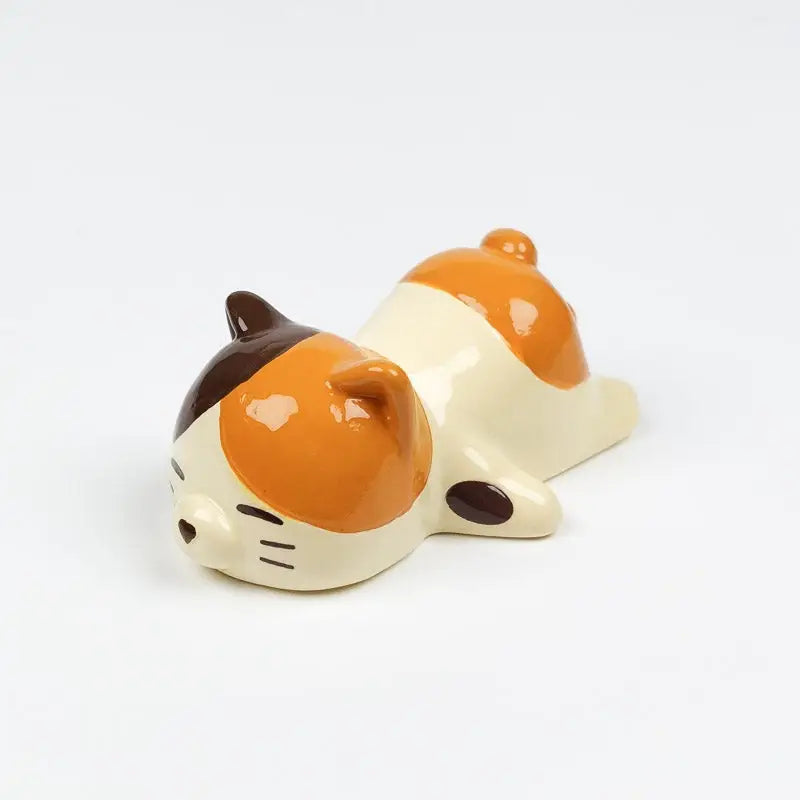 Gatto giapponese con bacchetta