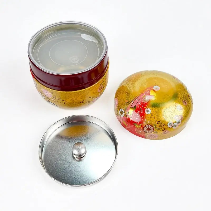 Scatola da tè rotonda in oro e rosso